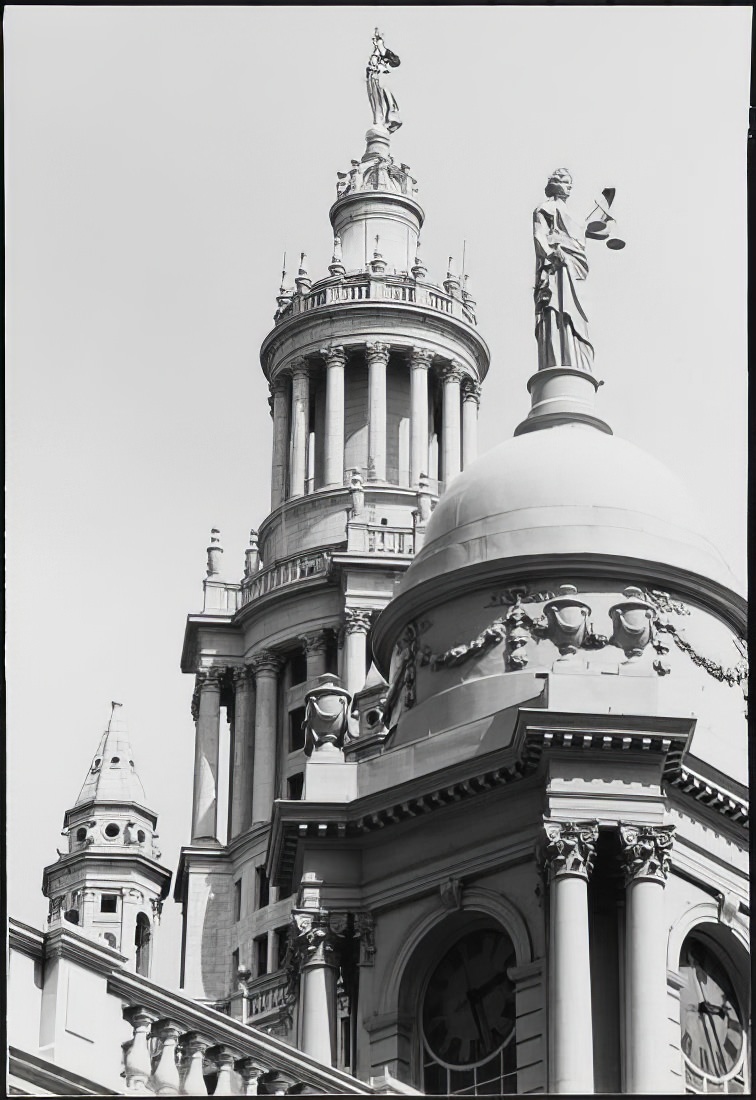 "Justice" statue on City Hall cupola, with "Civic Fame" statue on Municipal Building tower, 1973