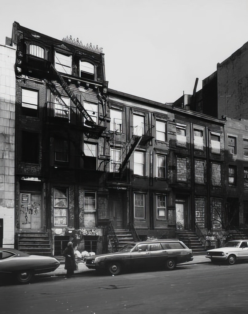 Boarded-up row houses on the north side of East 7th Street, near Avenue C, 1975