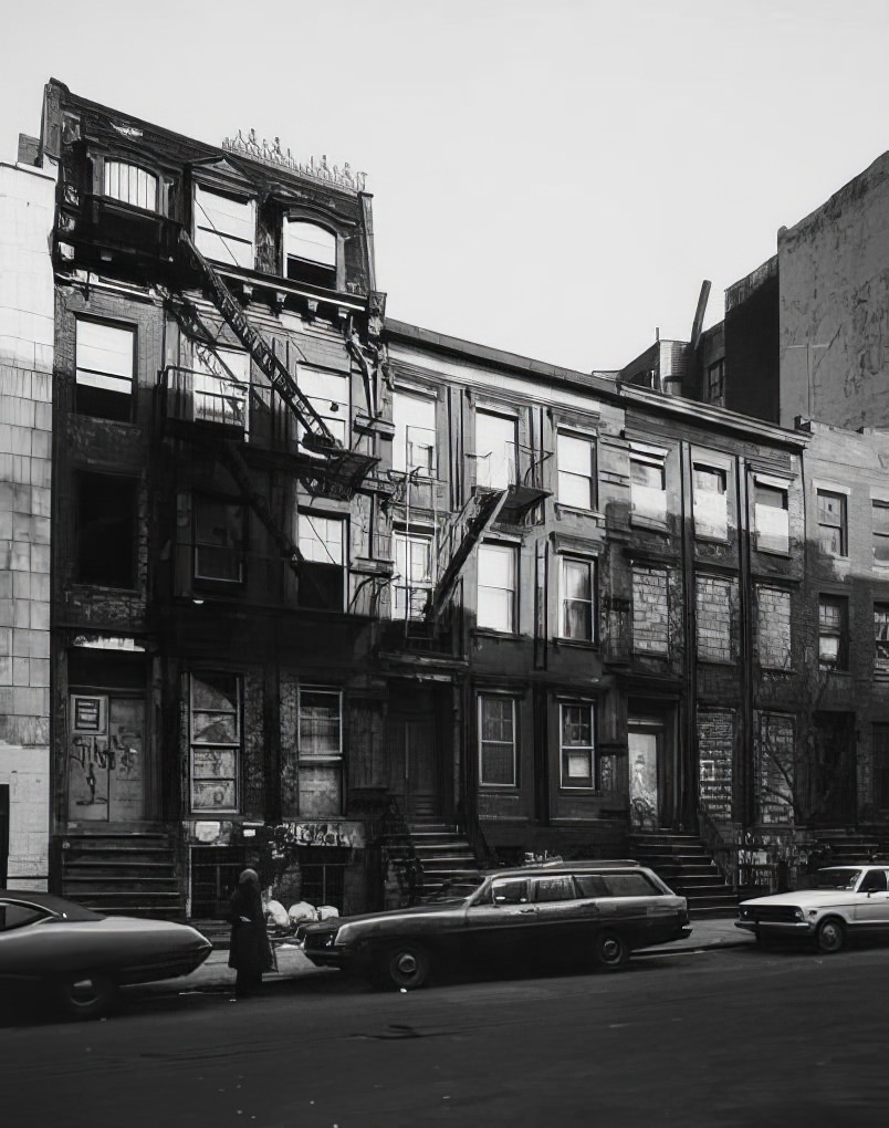 Boarded-up row houses on the north side of East 7th Street, near Avenue C, 1975