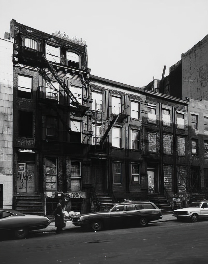 Boarded-up row houses on the north side of East 7th Street, near Avenue C, 1975