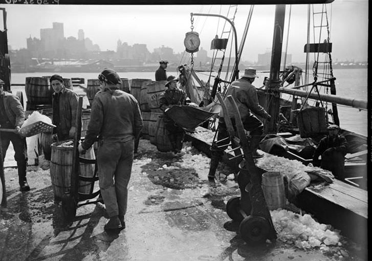 Fulton Fish Market: Unloading Fish, 1938.