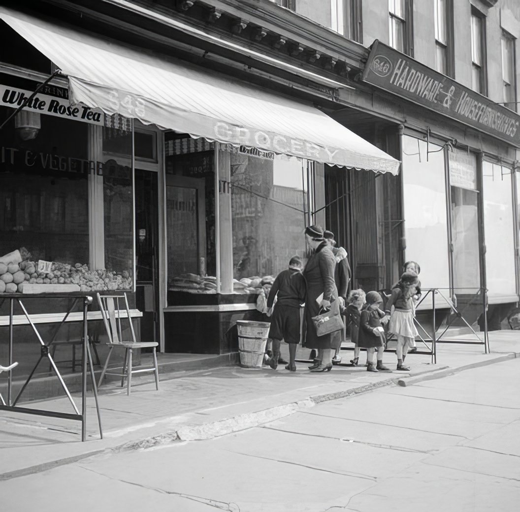 Family in front of a grocery store, 1935.