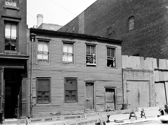 Wood houses and roadway under construction, 1935.