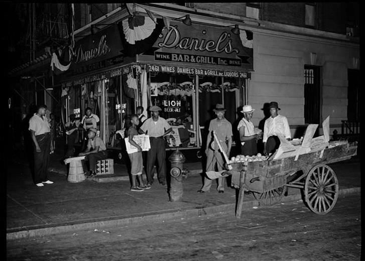 Street scene outside Daniel's Bar and Grill, 1939.