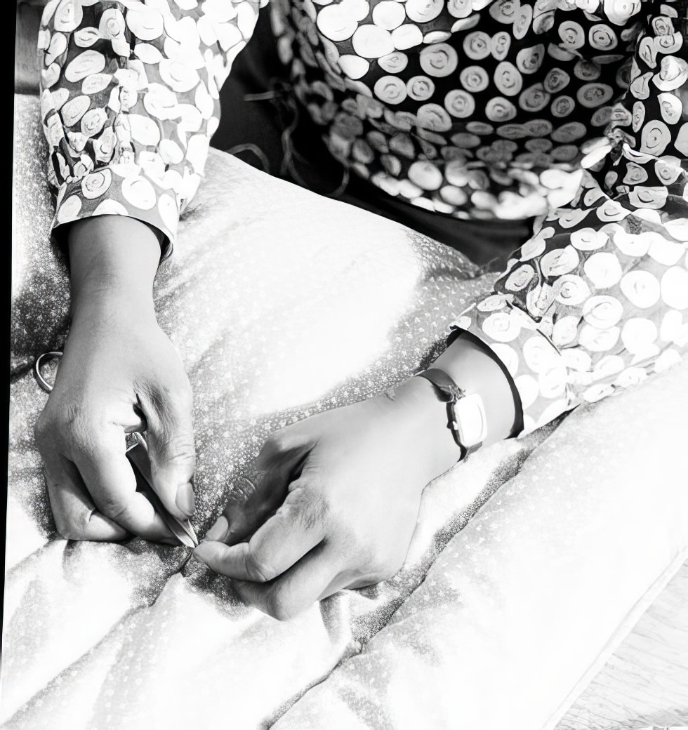 Finishing a quilt, 1937.