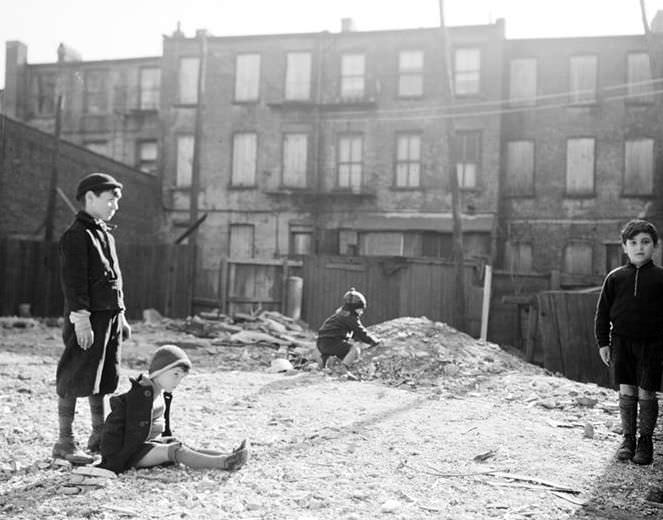 Children playing in a vacant lot, 1936.