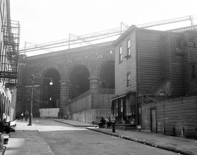 Wooden house next to a bridge, 1936