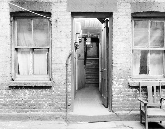 Looking into hallway of an old brick house, 1936