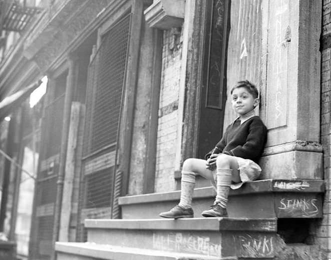 Boy on a crumbling stoop, 1936