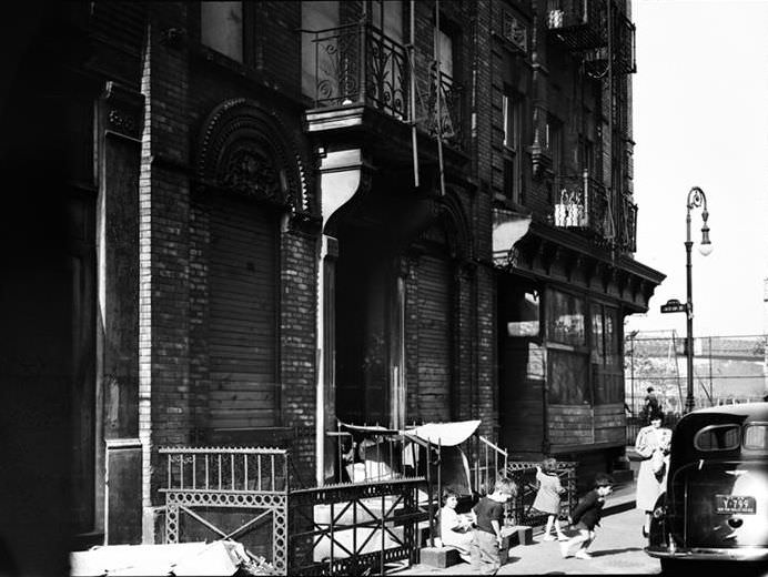 Children playing on the sidewalk, 1936