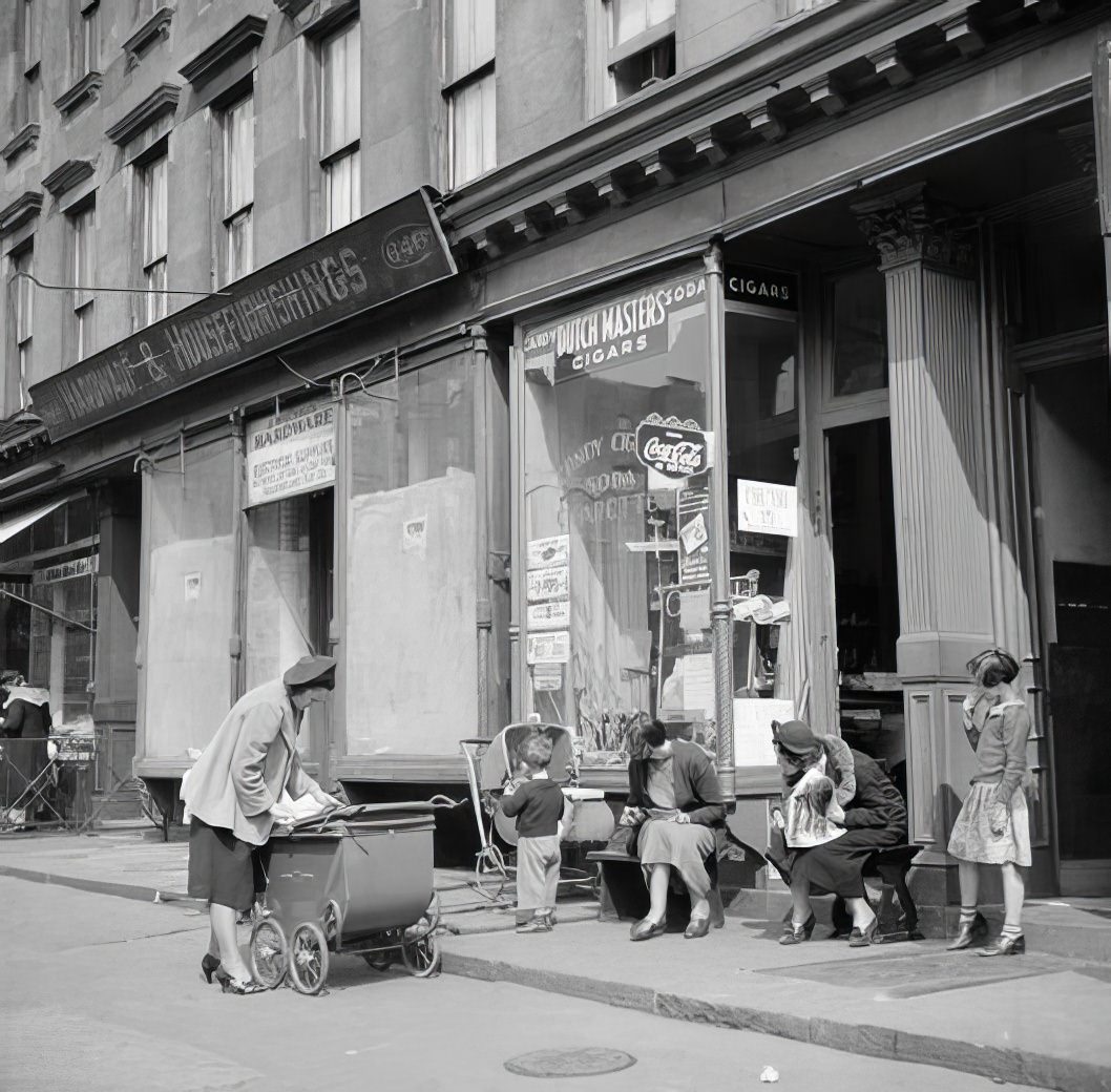 Woman and children in street, 1935