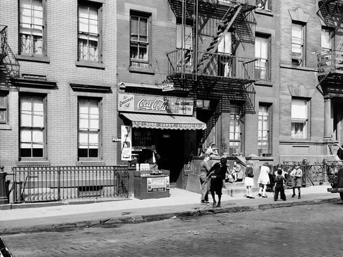 Children playing in front of a candy store, 1935