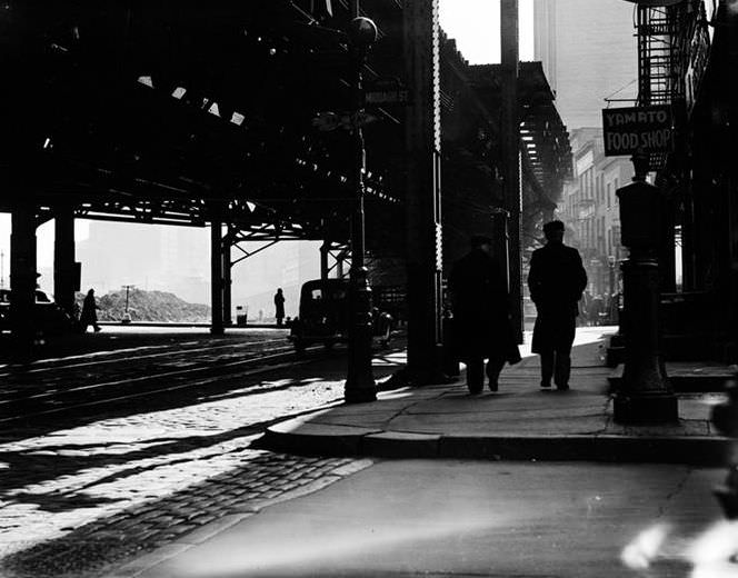 Waterfront scene with Yamato Food Shop under the El, 1937.