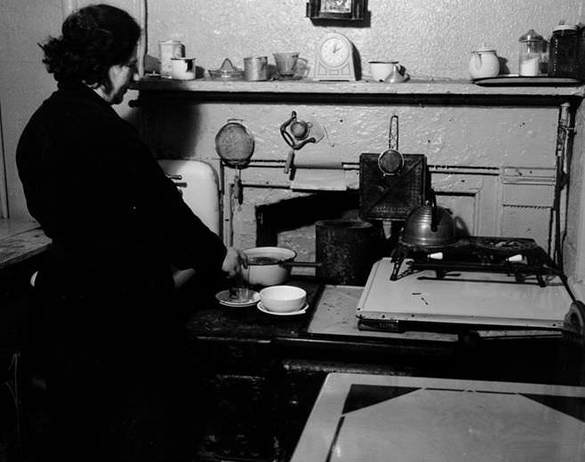 Woman in kitchenette, 1935