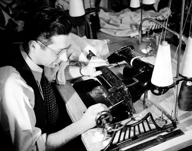 Fixing a sewing machine on 10th Ave & 36th St, 1937.