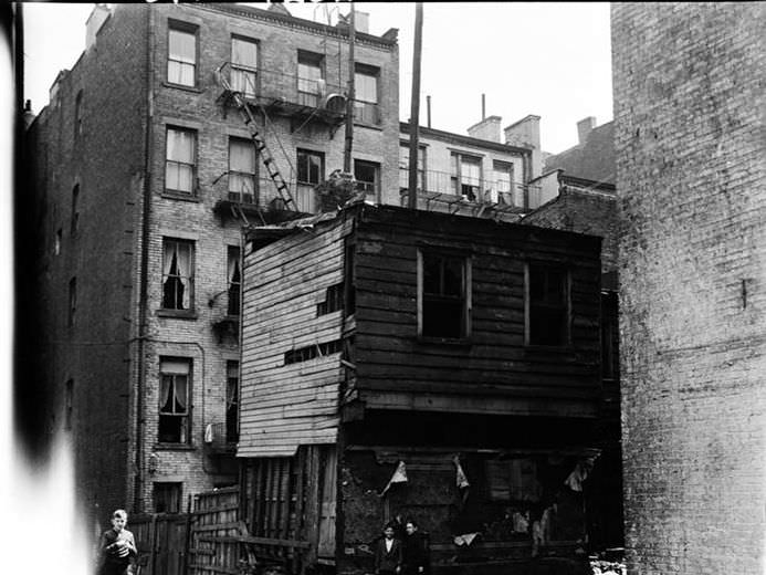 Wooden house in rear, 1936.