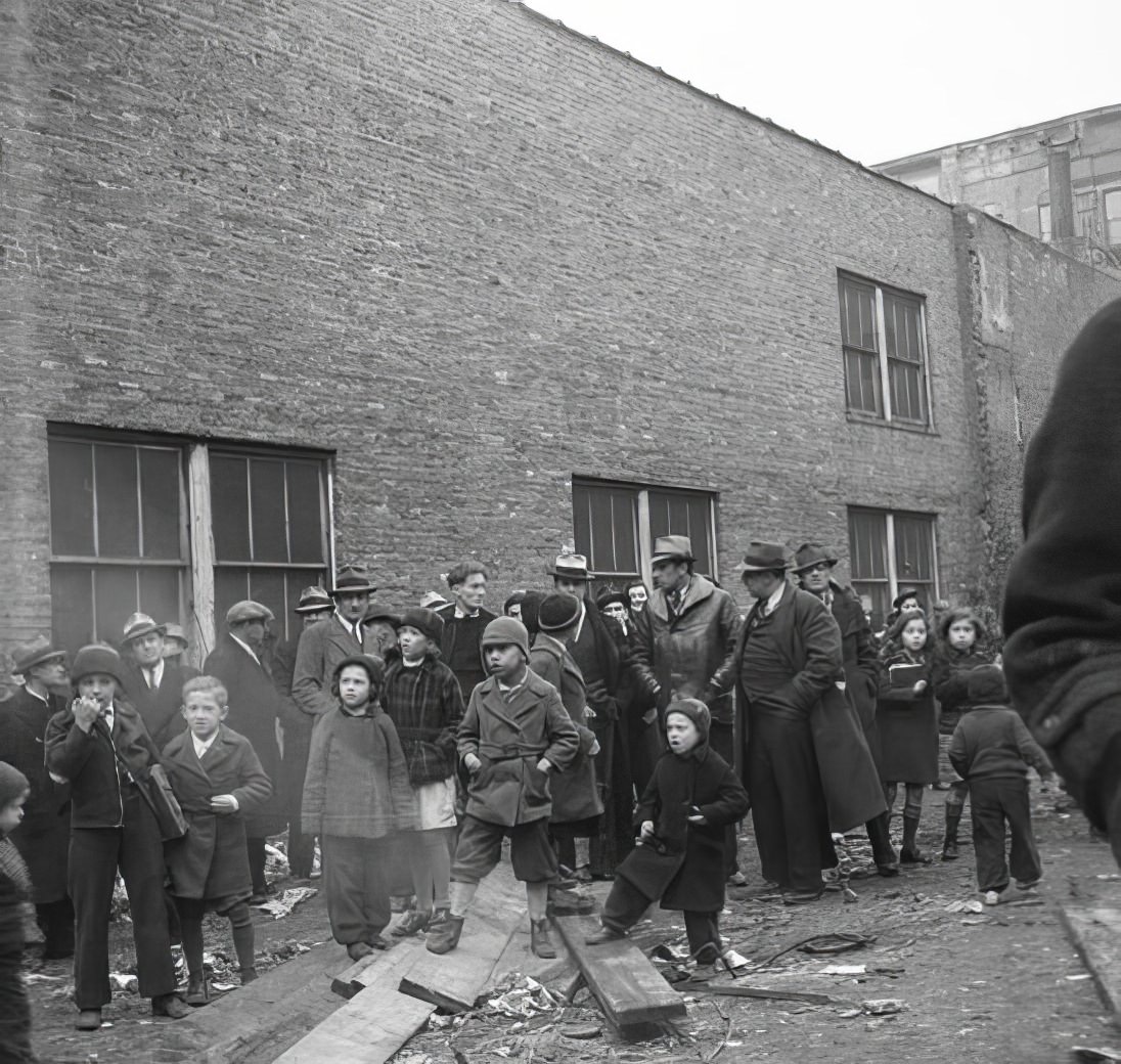 Large group of people in courtyard, 1936.