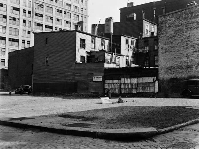 Empty lot and back of wooden houses, 1936.