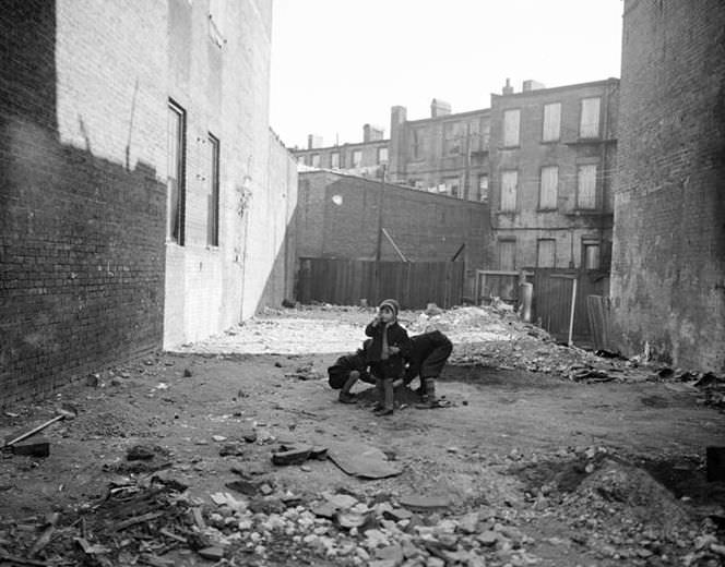 Children playing in vacant lot, 1935.