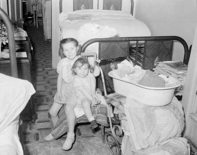 Two children in a railroad flat, 1935.