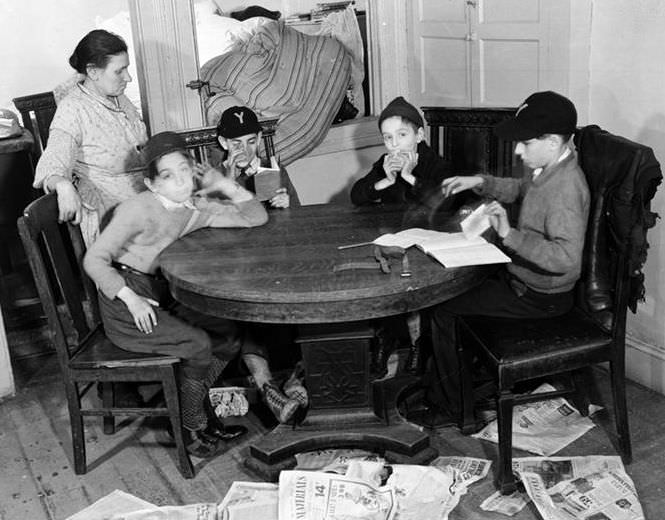 Four boys around table, 1936.