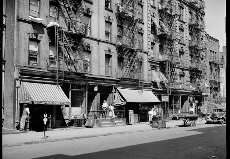 Street scene on 133rd Street between Lenox and Fifth Avenues, 1939.