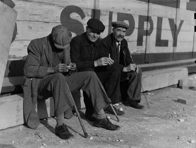 Three men with canes, 1936.