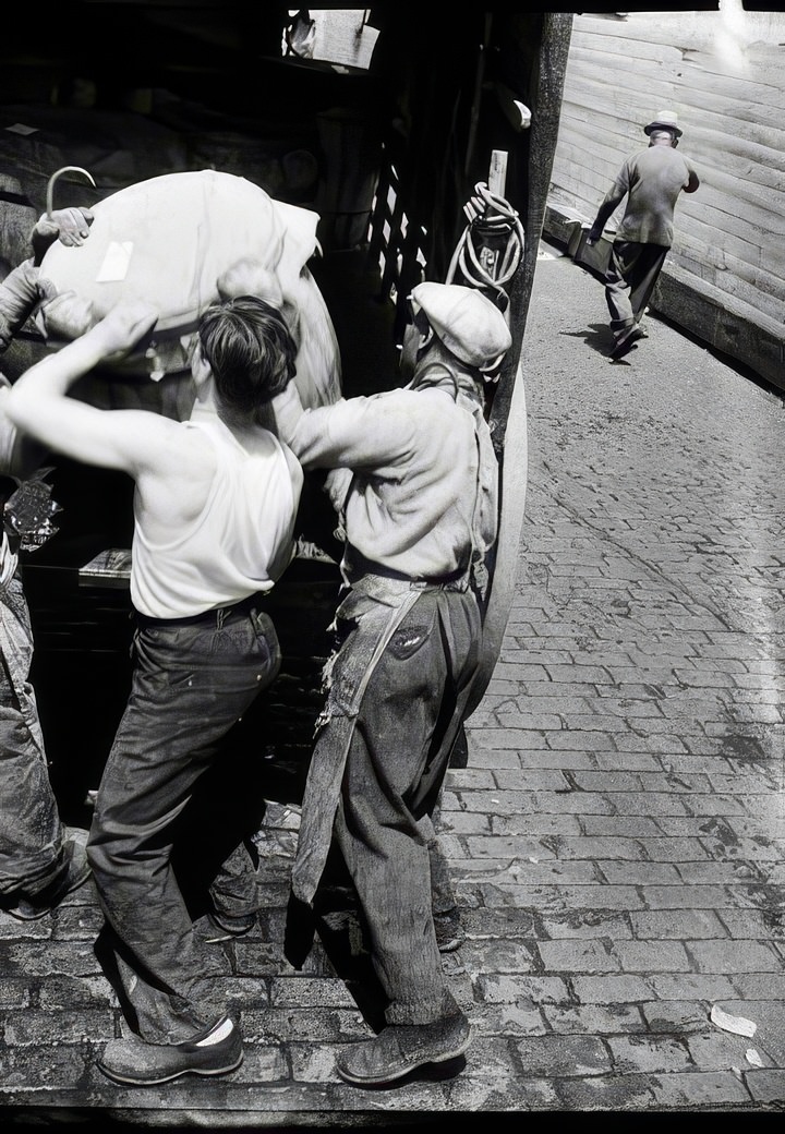 Loading fish at the Fulton Street Fish Market, 1938.