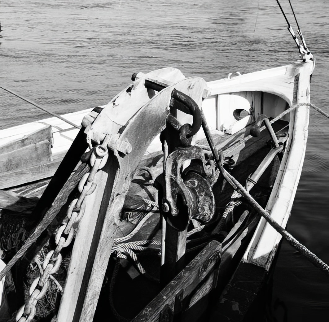 Waterfront scene: bow or stern of a ship, May 1937.