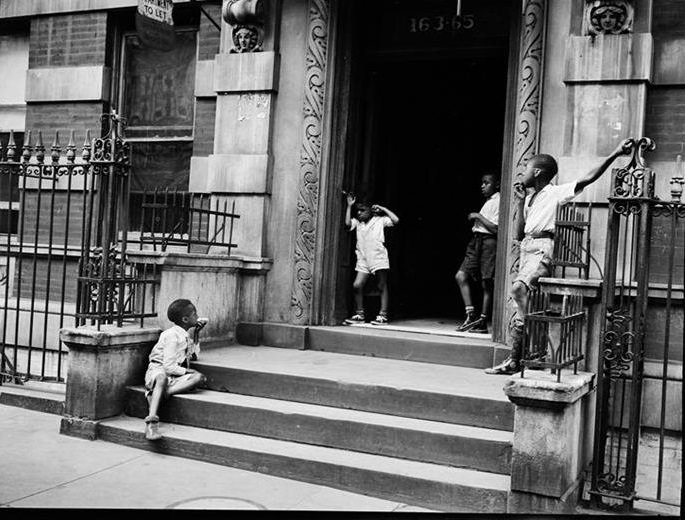 Boys on a stoop in Harlem, 1939.