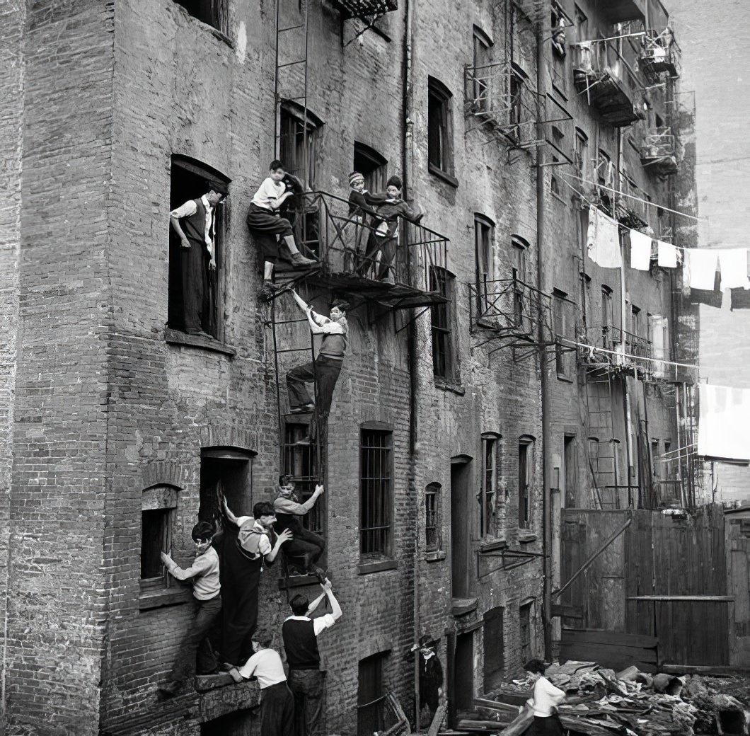 Boy climbing a fire escape, 1935.