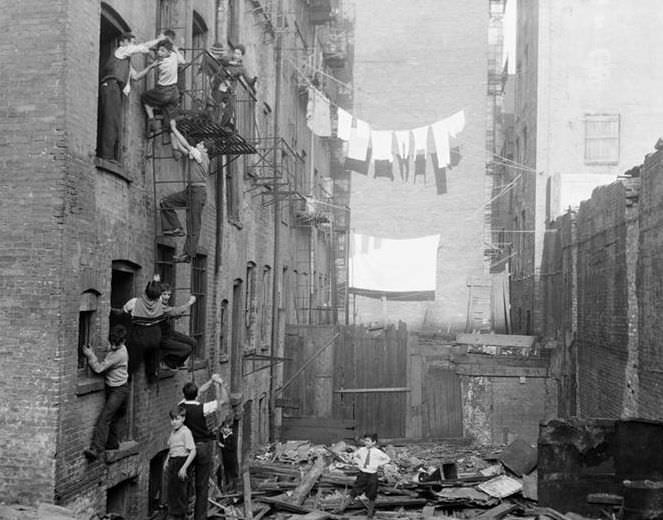 Courtyard with children on fire escapes, 1935.