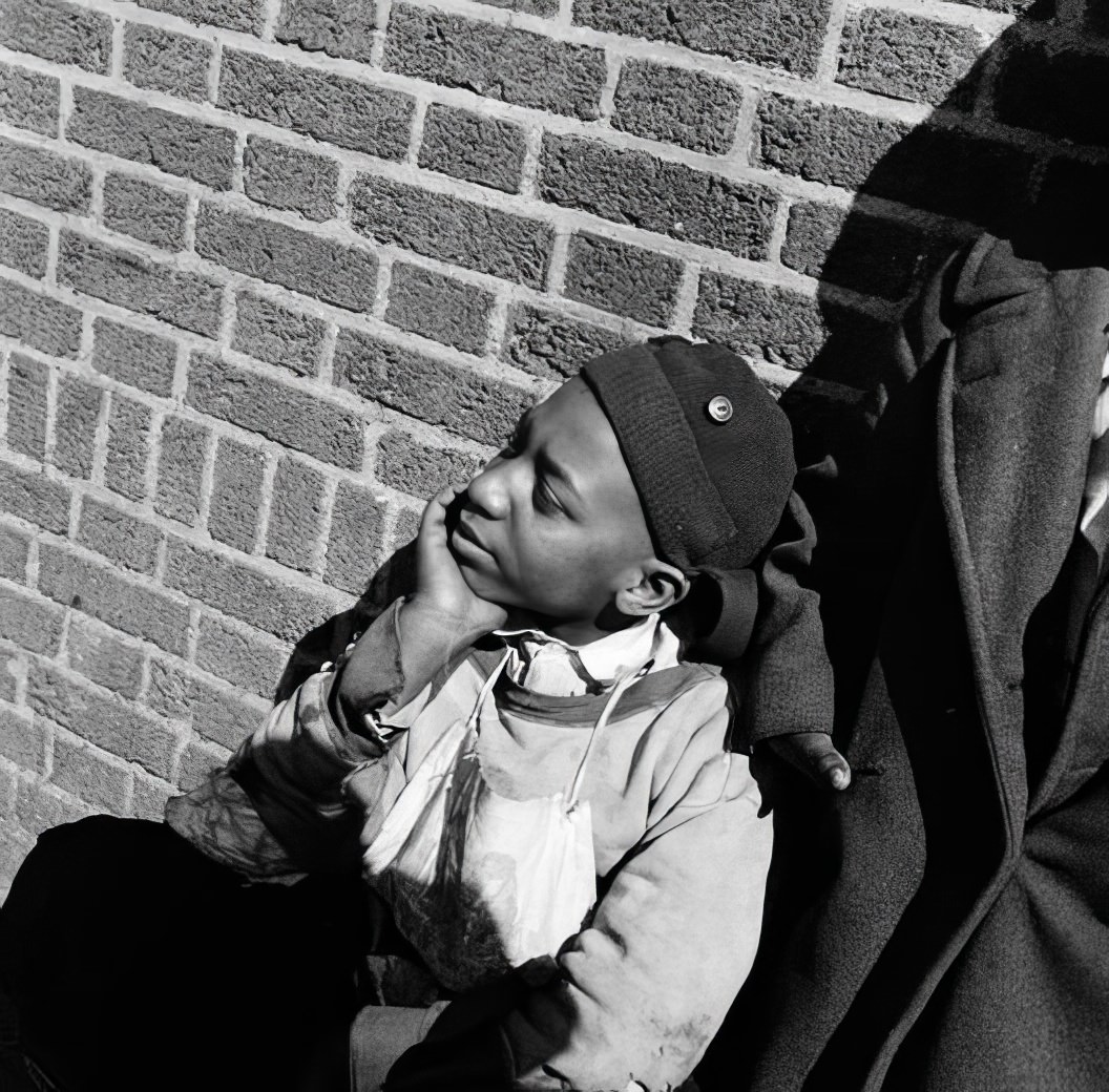 Waterfront scene: boy in a knit cap, May 1937.