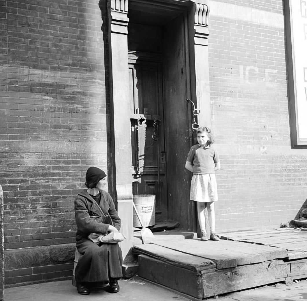 Girl and man on a doorstep, 1936.