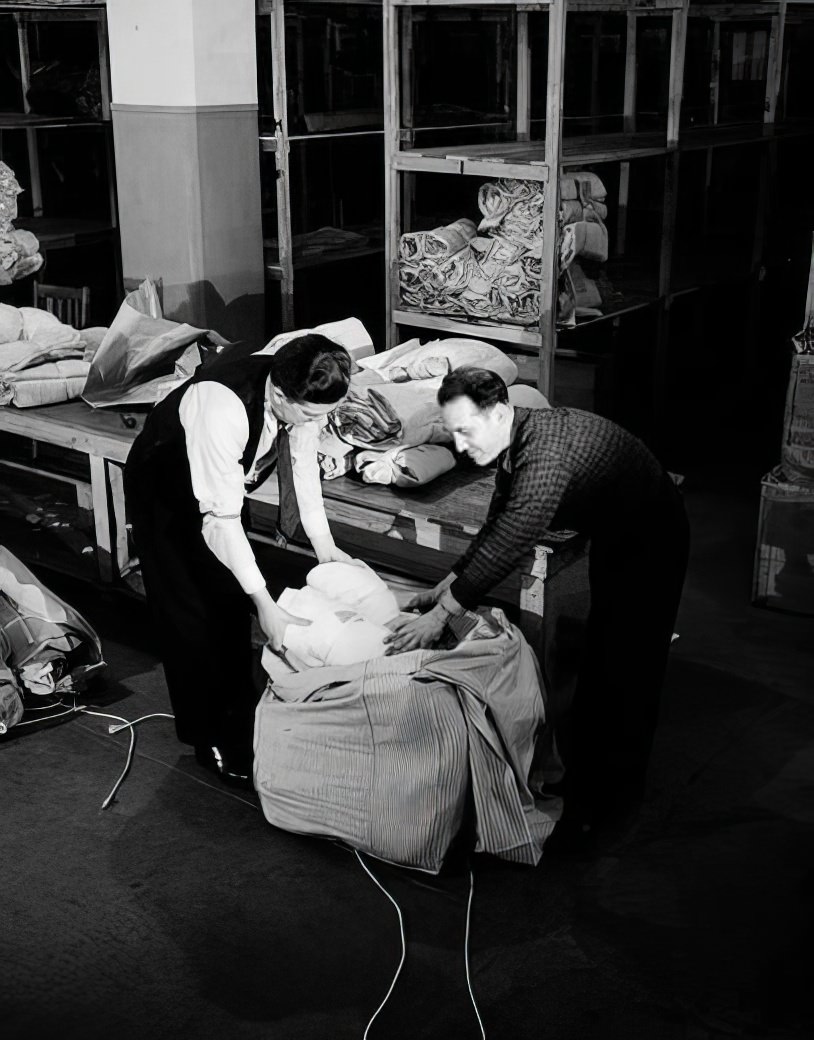 Packing a bag on 10th Avenue and 36th Street, 1937.