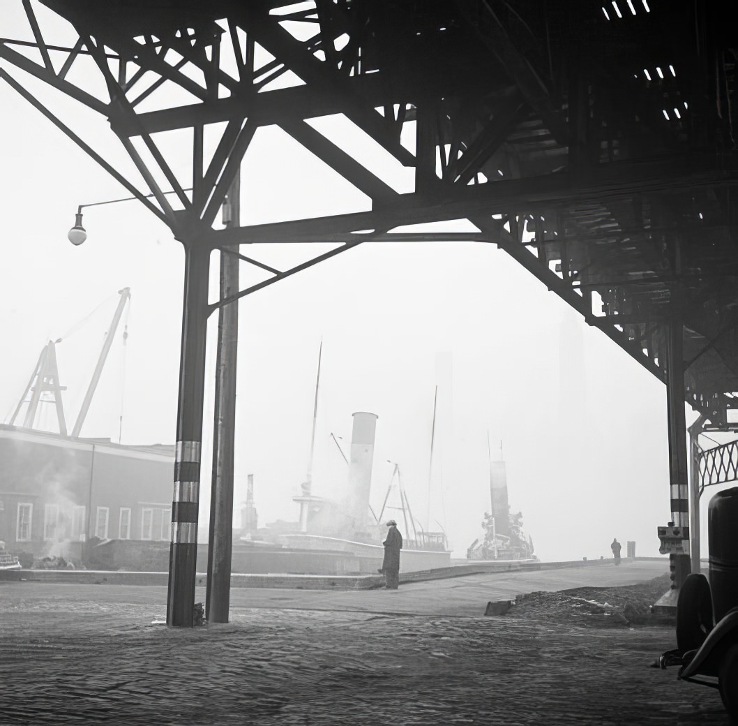 Waterfront scene: under an elevated railway, May 1937.