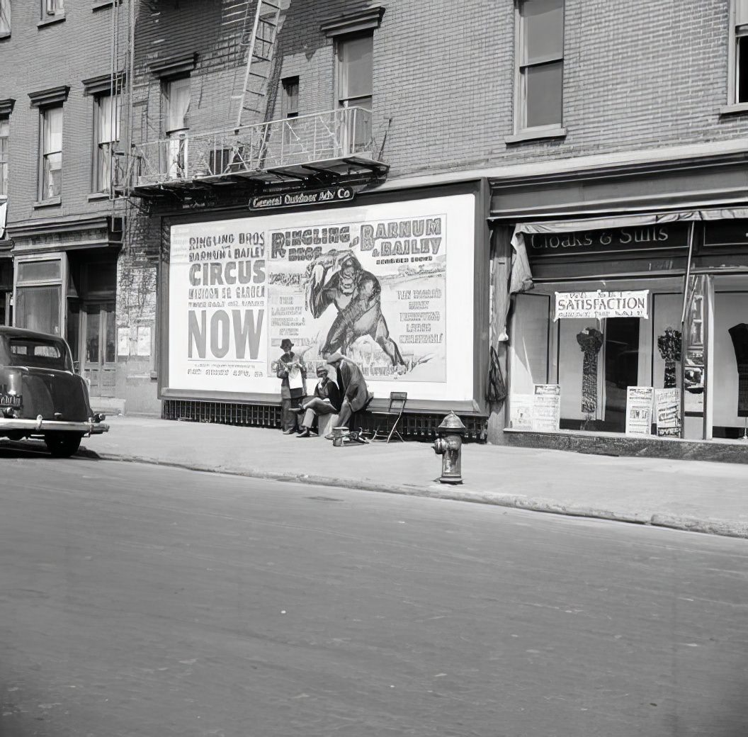 People in front of a circus poster, 1935.