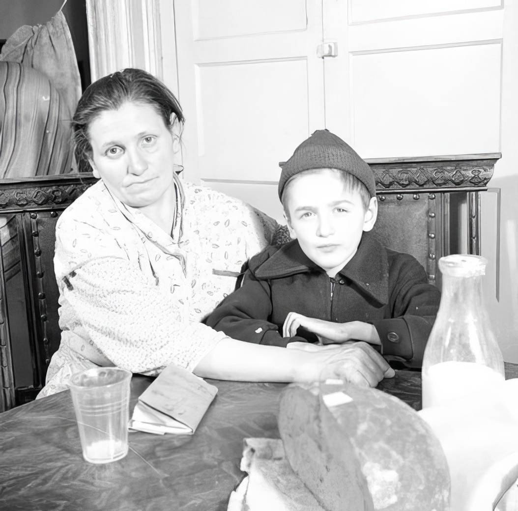 Mother and son at table, 1935.