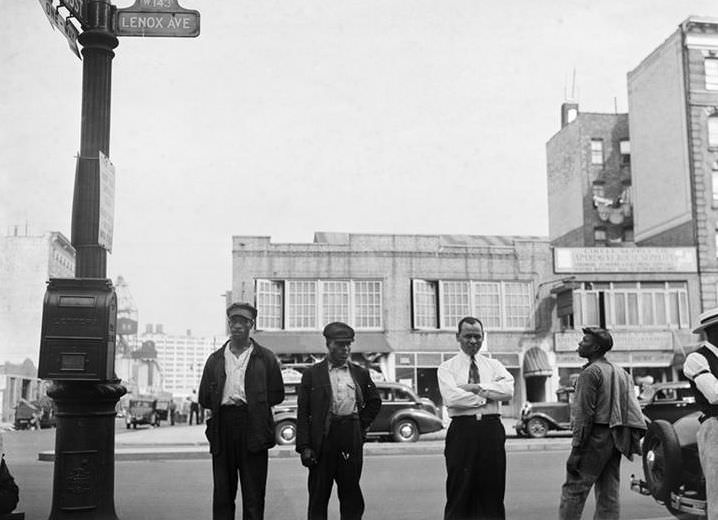 Men standing on Lenox Avenue, Harlem, 1940.