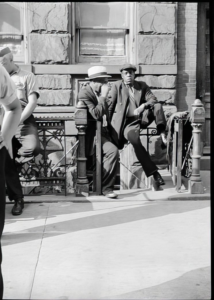 Two men on a Harlem stoop, 1939.