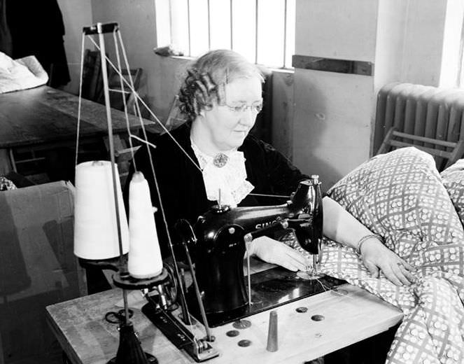 Stitching a quilt on 10th Avenue and 36th Street, 1937.