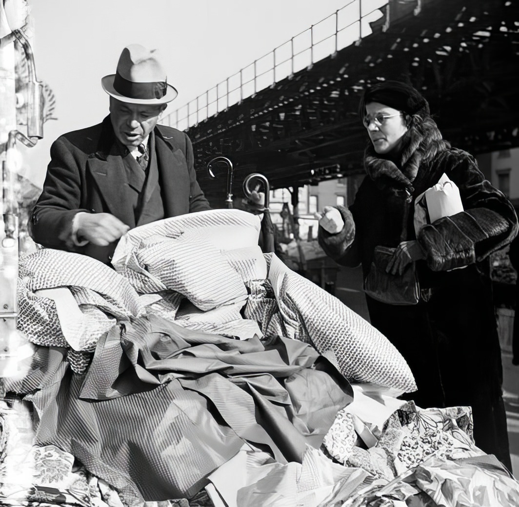 Buying cloth on First Ave & 8th St, 1935.