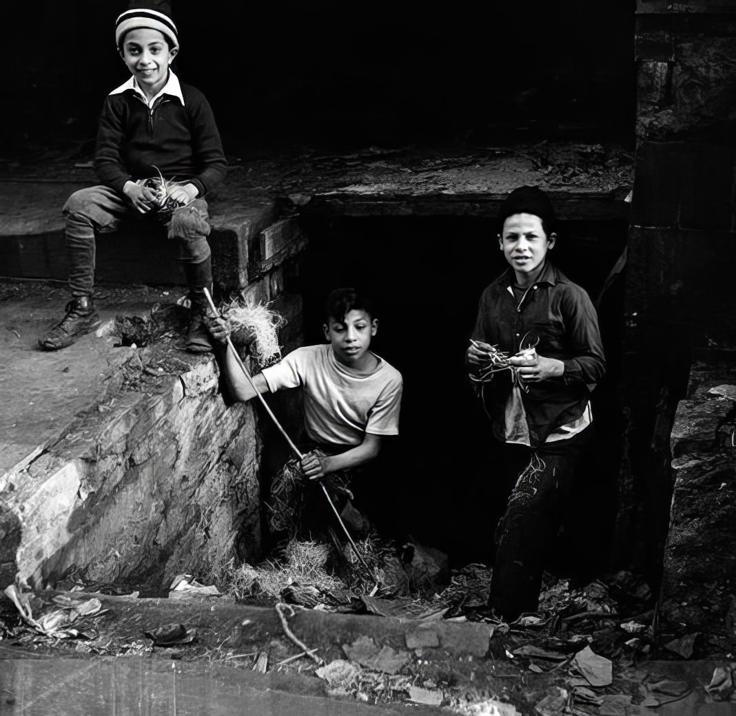 Boys playing in a ditch, 1936.