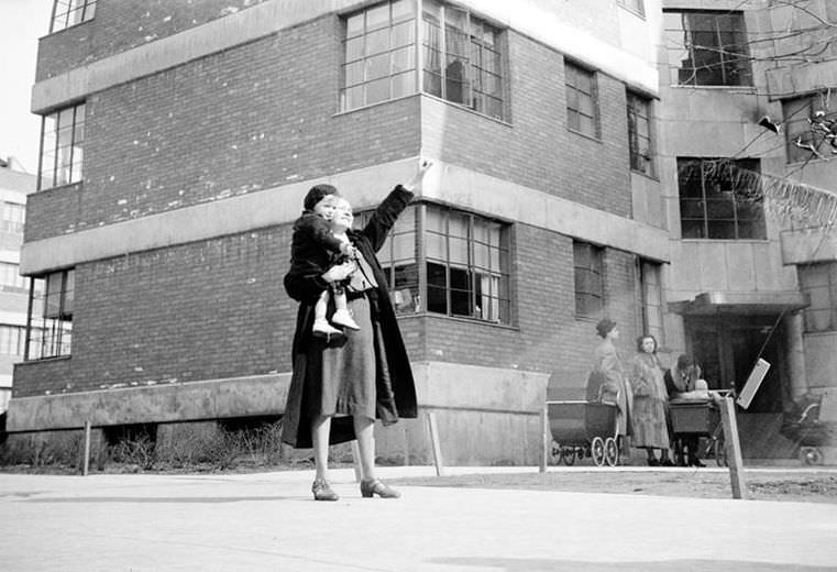 Woman with a small child, 1936.