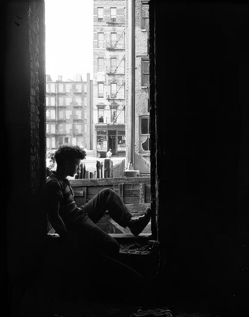 Boy sitting in window, 1936.