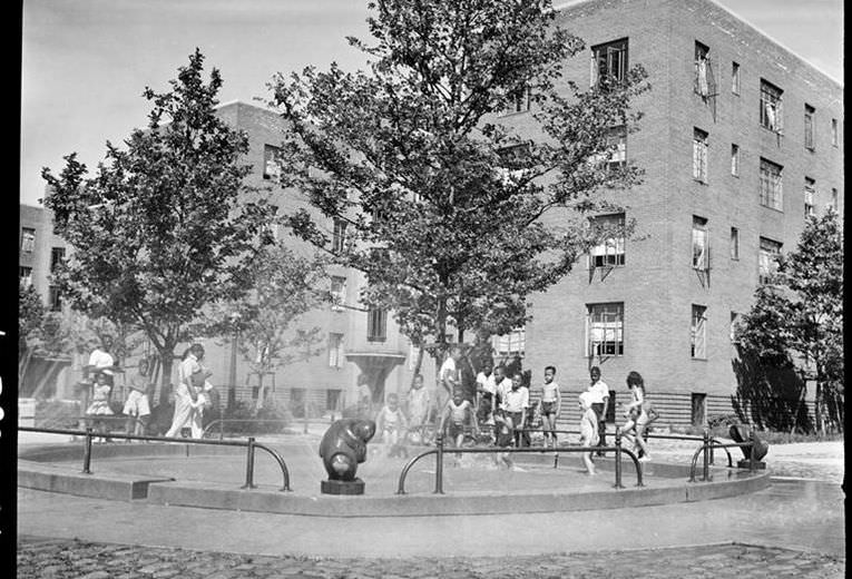 Children in the playground of a Harlem housing project, 1939.