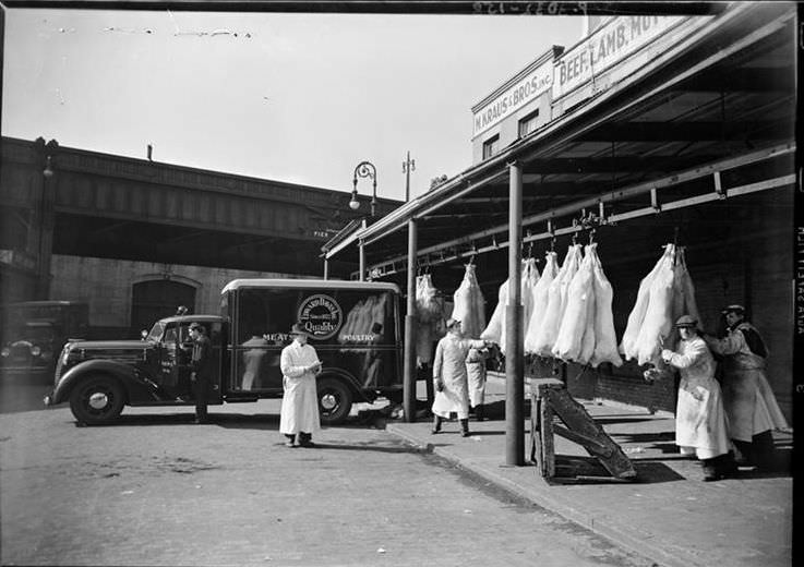 Beef weighing and loading at West Washington Market, 1938.