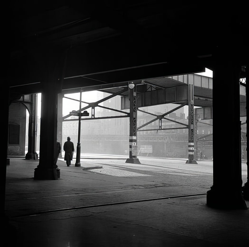 Waterfront scene: underneath the elevated subway, May 1938.