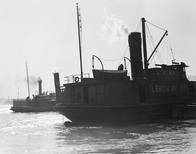 Waterfront scene with two tugboats, 1937.