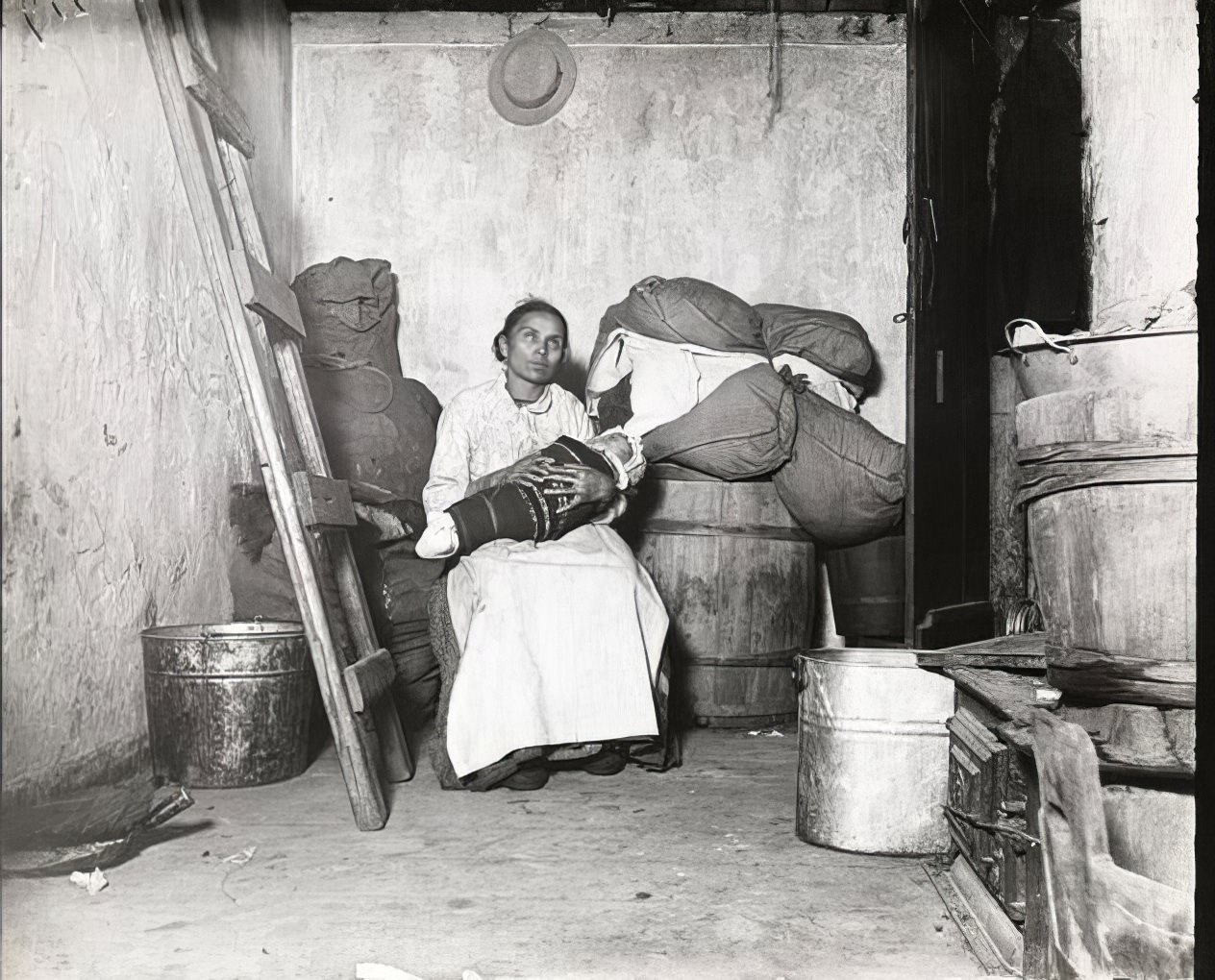 In the home of an Italian rag picker, Jersey Street, 1891.